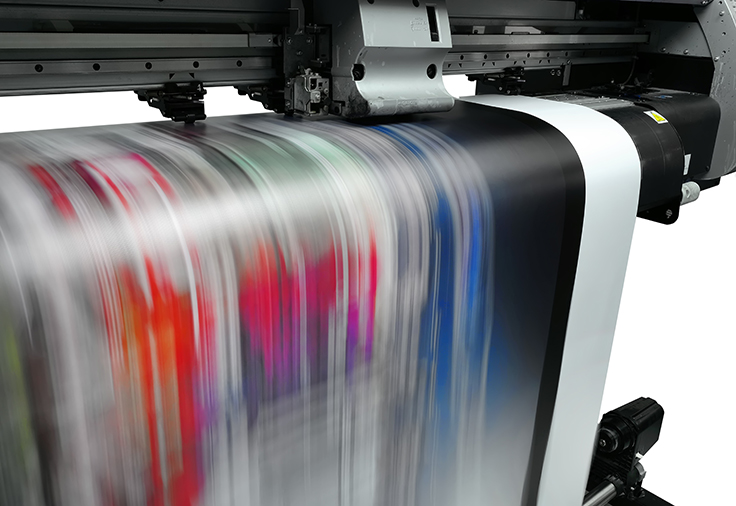 A wide-format printer in operation.